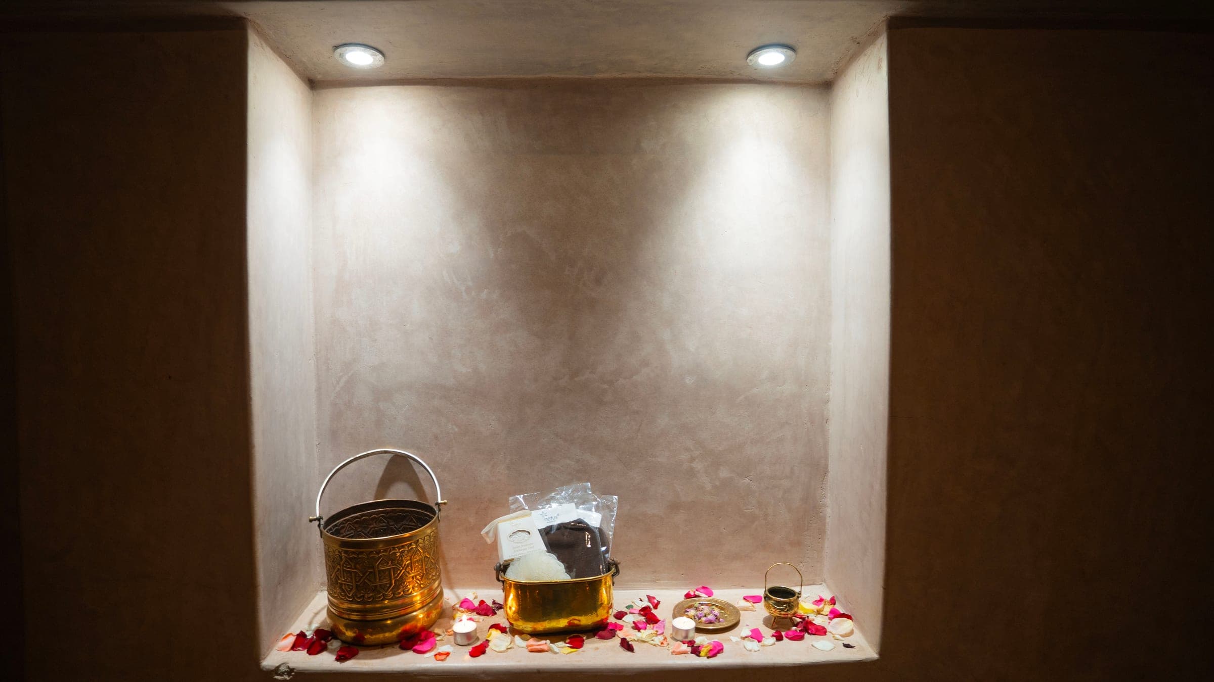 Brass hammam buckets and rose petals at Le Bain Blanc, Marrakech